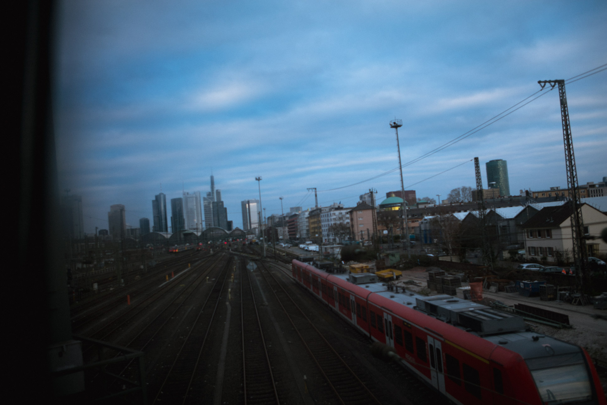 The skyline of Frankfurt's Bankenviertel (financial district) is visible in the background.