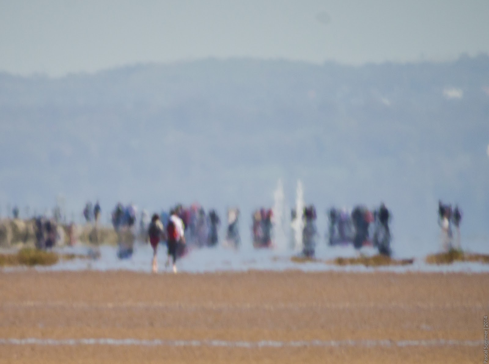 The beach, as seen through a telescope. The air distortion makes it look like an oil painting :)
