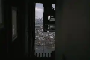 inside the cable car station, looking down at Tromsø